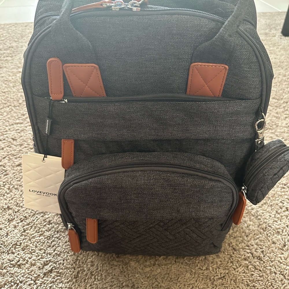 Never Used Lovevook diaper bag with changing area and mobile device support